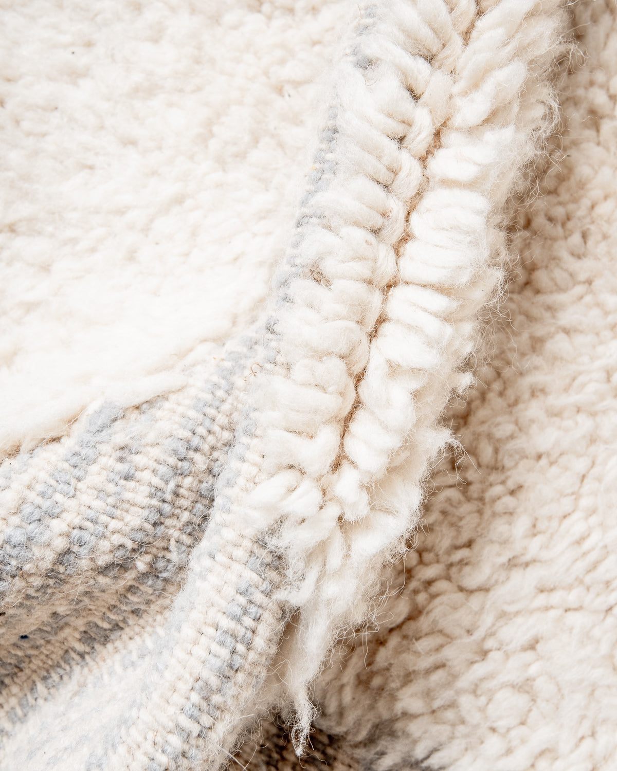 Modern, designer, handcrafted Berber rug from Morocco. Beniourain carpet with beautiful colours and patterns and fluffy wool texture.